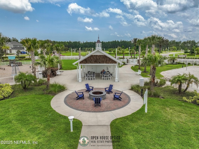 105 Awlleaf Ct, Saint Augustine, FL 32095 - surrounding community with an outdoor fire pit and a patio area