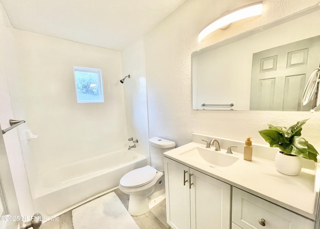 7381 Fernandina Ave, Jacksonville, FL 32208 - bathroom with vanity, toilet, shower / washtub combination, and a textured wall