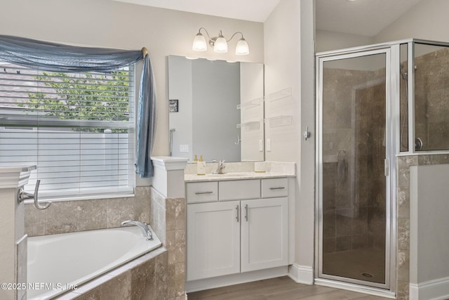 2623 Cold Stream Ln, Green Cove Springs, FL 32043 - bathroom with vanity, a stall shower, a bath, and wood finished floors