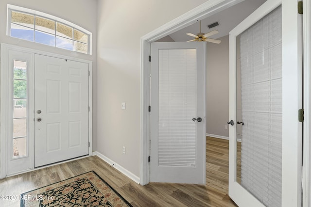 1608 Rustling Dr, Fleming Island, FL 32003 - foyer featuring wood finished floors, ceiling fan, and baseboards