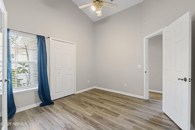 1608 Rustling Dr, Fleming Island, FL 32003 - unfurnished room featuring high vaulted ceiling, baseboards, a ceiling fan, and light wood-style flooring