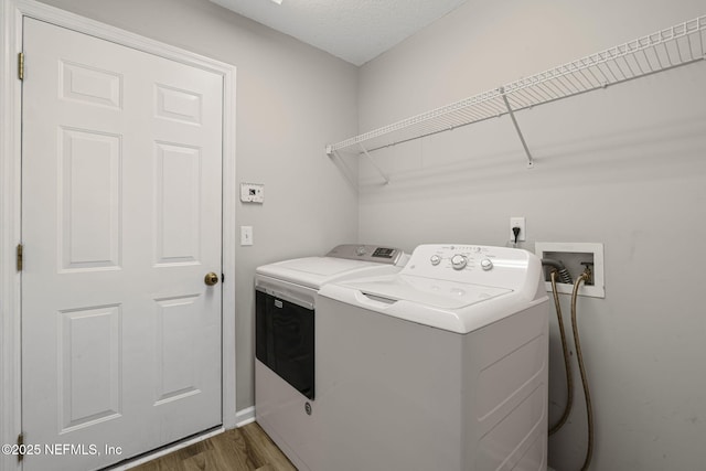 1608 Rustling Dr, Fleming Island, FL 32003 - laundry area featuring separate washer and dryer and wood finished floors