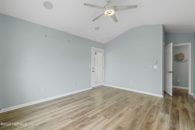 1608 Rustling Dr, Fleming Island, FL 32003 - spare room featuring vaulted ceiling, a ceiling fan, wood finished floors, and baseboards