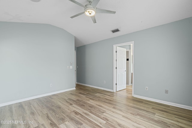 1608 Rustling Dr, Fleming Island, FL 32003 - unfurnished room featuring ceiling fan, lofted ceiling, light wood finished floors, and baseboards