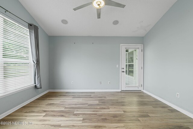 1608 Rustling Dr, Fleming Island, FL 32003 - unfurnished room with a ceiling fan, light wood-type flooring, baseboards, and lofted ceiling