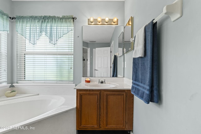 1608 Rustling Dr, Fleming Island, FL 32003 - bathroom featuring vanity and a garden tub