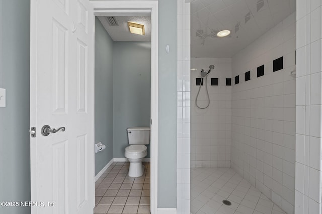1608 Rustling Dr, Fleming Island, FL 32003 - bathroom with a shower stall, tile patterned floors, toilet, and baseboards