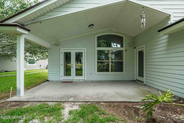 1608 Rustling Dr, Fleming Island, FL 32003 - back of property with a patio area and french doors