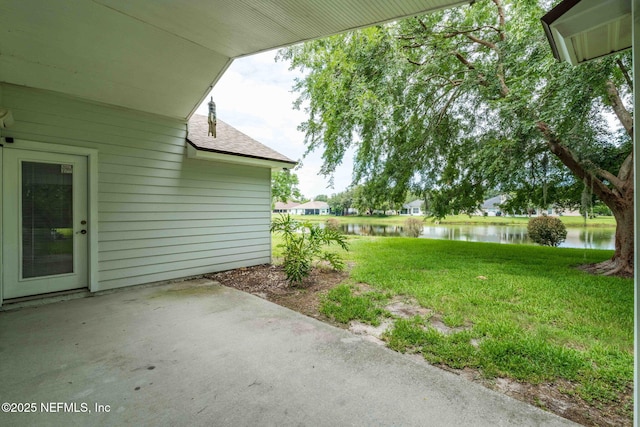 1608 Rustling Dr, Fleming Island, FL 32003 - view of green lawn with a patio and a water view