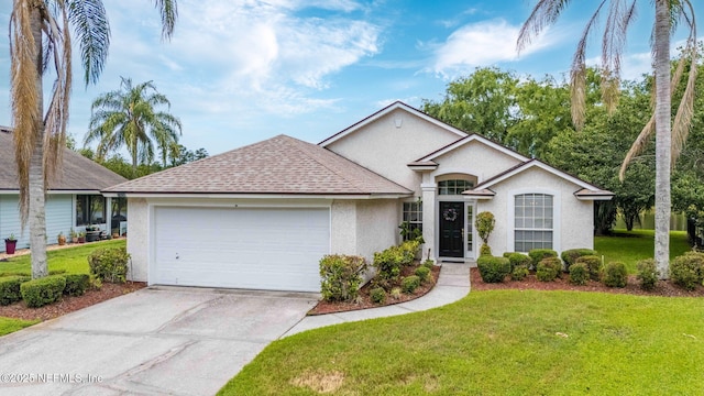 1608 Rustling Dr, Fleming Island, FL 32003 - ranch-style house with stucco siding, a garage, roof with shingles, driveway, and a front yard