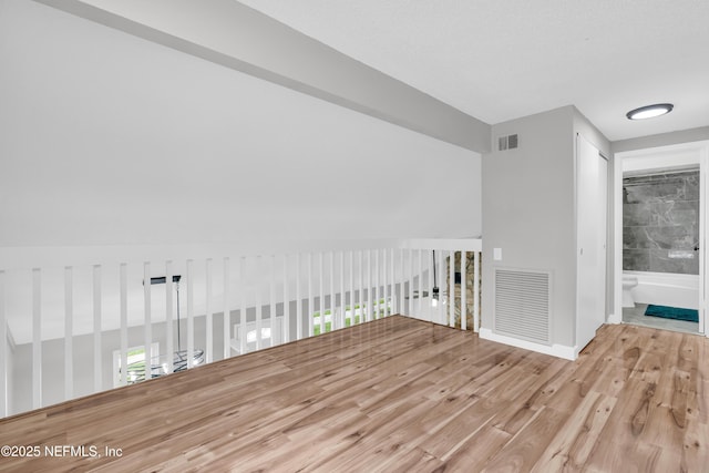 8687 Bishopswood Dr, Jacksonville, FL 32244 - empty room with wood finished floors and baseboards