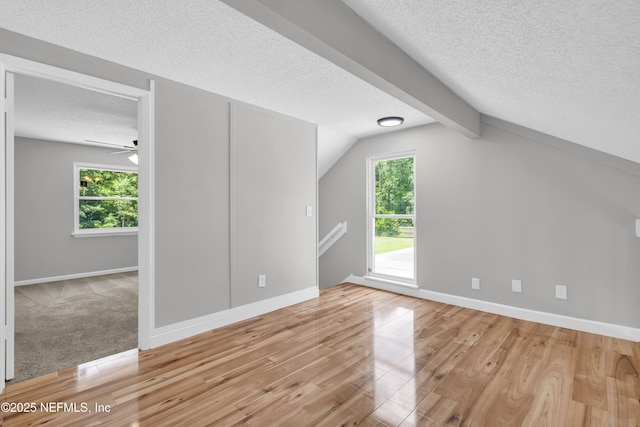 8687 Bishopswood Dr, Jacksonville, FL 32244 - additional living space featuring light wood finished floors, a textured ceiling, healthy amount of natural light, and a ceiling fan