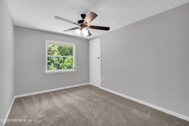 8687 Bishopswood Dr, Jacksonville, FL 32244 - carpeted empty room with a textured ceiling and a ceiling fan