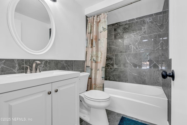 8687 Bishopswood Dr, Jacksonville, FL 32244 - full bath featuring tile walls, vanity, shower / bath combo, and wainscoting