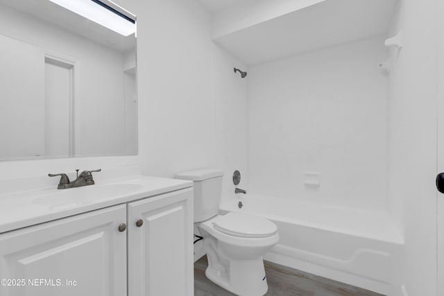 8687 Bishopswood Dr, Jacksonville, FL 32244 - full bathroom featuring vanity, wood finished floors, and shower / tub combination