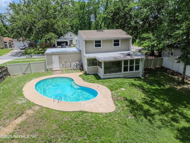 8687 Bishopswood Dr, Jacksonville, FL 32244 - rear view of house with a sunroom and a fenced backyard