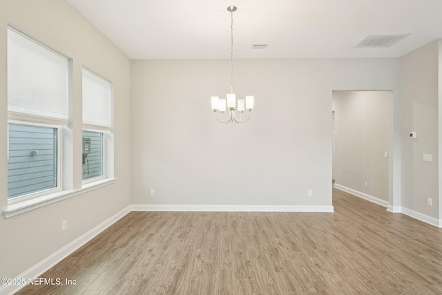 68 Briar Ridge Ct, Ponte Vedra, FL 32081 - unfurnished room featuring a chandelier and wood finished floors