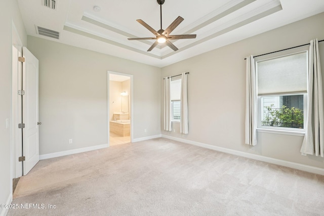 68 Briar Ridge Ct, Ponte Vedra, FL 32081 - unfurnished bedroom with a tray ceiling, light carpet, and connected bathroom