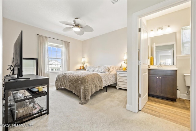 37 Permit Ct, Saint Augustine, FL 32092 - bedroom with light carpet, ensuite bathroom, and a ceiling fan