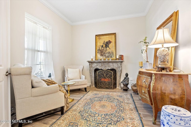 37 Permit Ct, Saint Augustine, FL 32092 - sitting room featuring wood finished floors, crown molding, and a lit fireplace