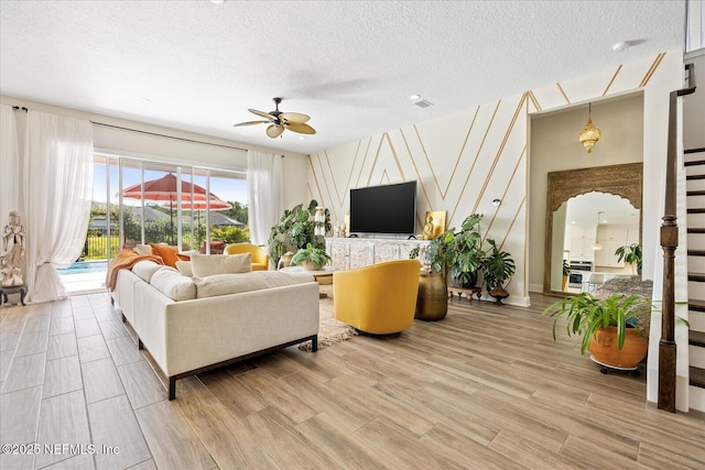 37 Permit Ct, Saint Augustine, FL 32092 - living area with a ceiling fan, wood finished floors, and a textured ceiling