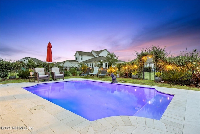 37 Permit Ct, Saint Augustine, FL 32092 - pool at dusk with a fenced backyard, a patio, and a gate