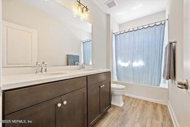 37 Permit Ct, Saint Augustine, FL 32092 - full bathroom with double vanity, shower / tub combo, and wood finished floors