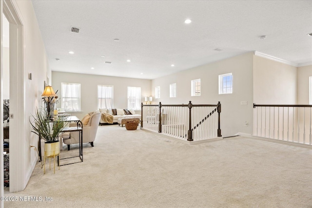 37 Permit Ct, Saint Augustine, FL 32092 - sitting room with carpet floors, an upstairs landing, recessed lighting, and ornamental molding