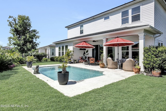 37 Permit Ct, Saint Augustine, FL 32092 - back of property featuring a patio, an outdoor pool, and a lawn