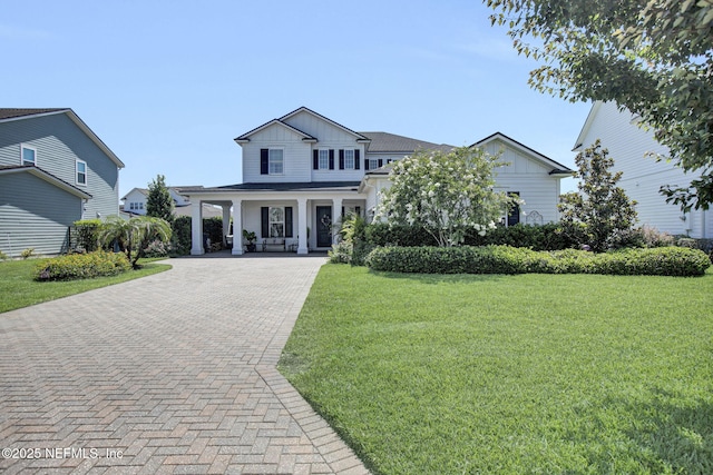 37 Permit Ct, Saint Augustine, FL 32092 - view of front of home featuring board and batten siding, a porch, a front yard, and decorative driveway