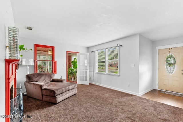 433 W 70th St, Jacksonville, FL 32208 - living area with carpet and baseboards