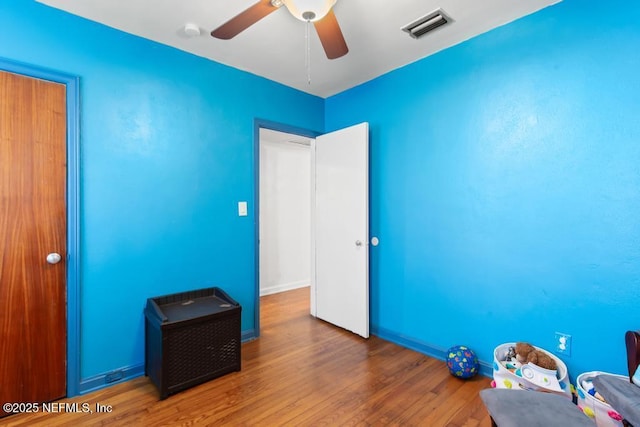433 W 70th St, Jacksonville, FL 32208 - unfurnished bedroom with wood finished floors and ceiling fan