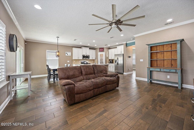 795 Shetland Dr, Saint Johns, FL 32259 - living area featuring a ceiling fan, dark wood-style flooring, a textured ceiling, ornamental molding, and recessed lighting