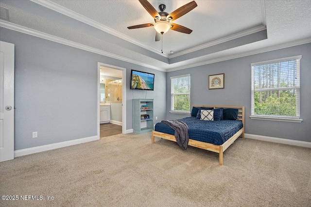 795 Shetland Dr, Saint Johns, FL 32259 - carpeted bedroom featuring a raised ceiling, crown molding, a textured ceiling, ensuite bathroom, and a ceiling fan