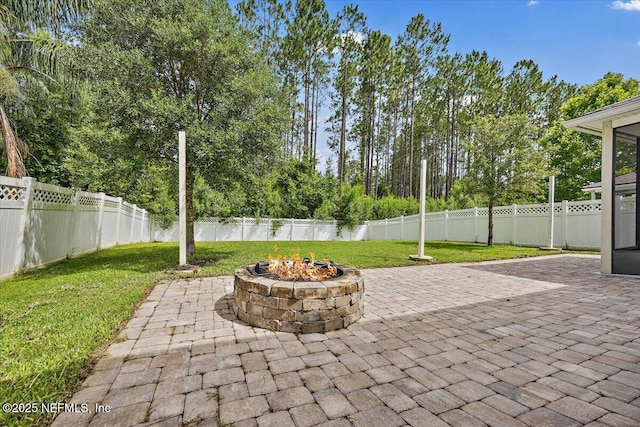 795 Shetland Dr, Saint Johns, FL 32259 - fenced backyard featuring a patio and an outdoor fire pit