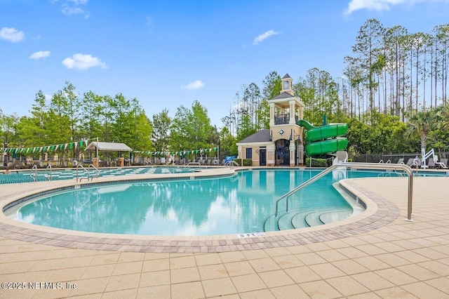 795 Shetland Dr, Saint Johns, FL 32259 - community pool featuring a water slide and view of scattered trees