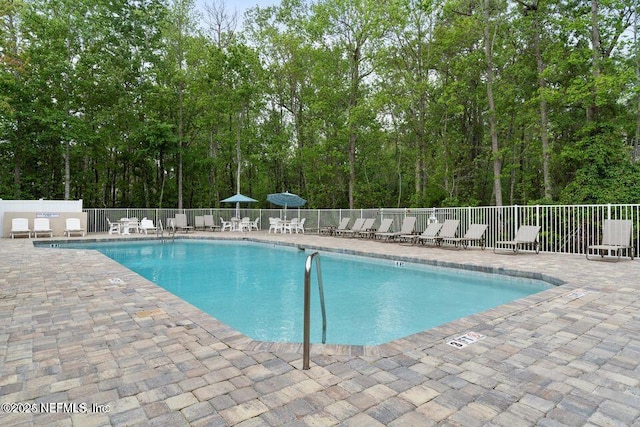 8601 Beach Blvd Unit 507, Jacksonville, FL 32216 - community pool with a patio area