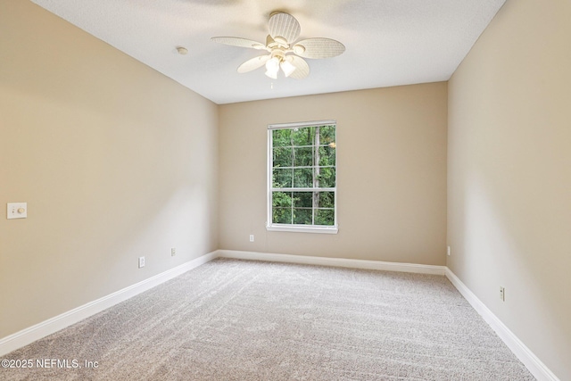 8601 Beach Blvd Unit 507, Jacksonville, FL 32216 - empty room featuring light carpet, ceiling fan, and baseboards