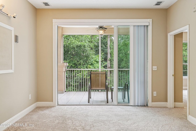 8601 Beach Blvd Unit 507, Jacksonville, FL 32216 - doorway to outside featuring plenty of natural light, carpet floors, ceiling fan, and baseboards