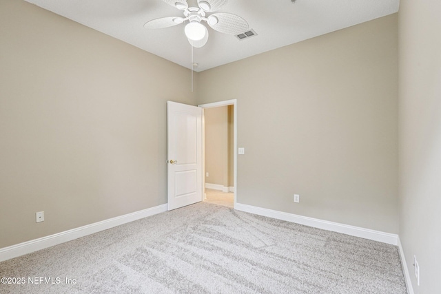 8601 Beach Blvd Unit 507, Jacksonville, FL 32216 - spare room featuring light carpet, ceiling fan, and baseboards