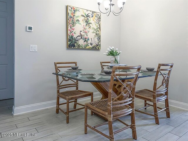 95191 Poplar Way, Fernandina Beach, FL 32034 - dining room with wood finish floors, a chandelier, and baseboards