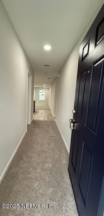 8051 Driggers St, Jacksonville, FL 32220 - hall featuring carpet floors and baseboards