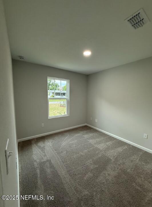 8051 Driggers St, Jacksonville, FL 32220 - carpeted spare room with baseboards, recessed lighting, and a smoke detector