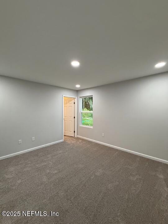 8051 Driggers St, Jacksonville, FL 32220 - unfurnished room with recessed lighting, baseboards, and dark carpet