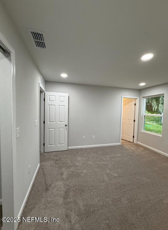 8051 Driggers St, Jacksonville, FL 32220 - carpeted empty room featuring recessed lighting and baseboards