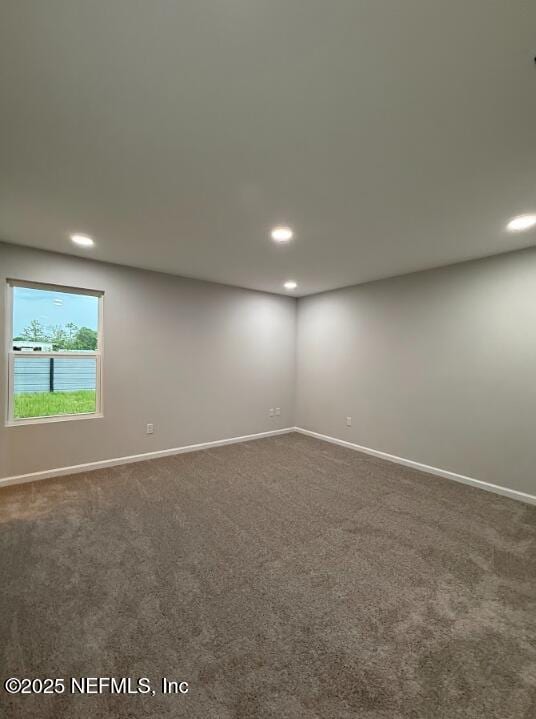 8051 Driggers St, Jacksonville, FL 32220 - unfurnished room with recessed lighting, dark carpet, and baseboards