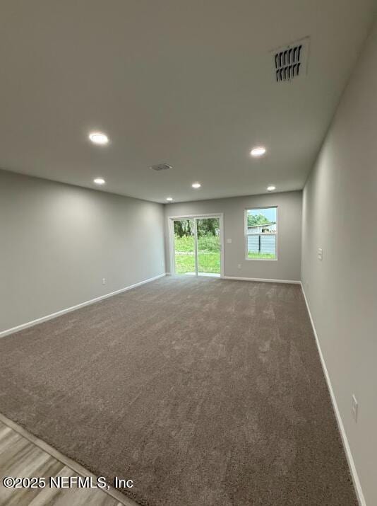 8051 Driggers St, Jacksonville, FL 32220 - carpeted empty room featuring baseboards and recessed lighting