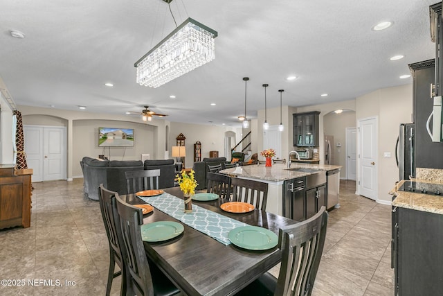 200 Ellsworth Cir, Saint Johns, FL 32259 - dining area with arched walkways, stairs, a ceiling fan, recessed lighting, and light tile patterned floors