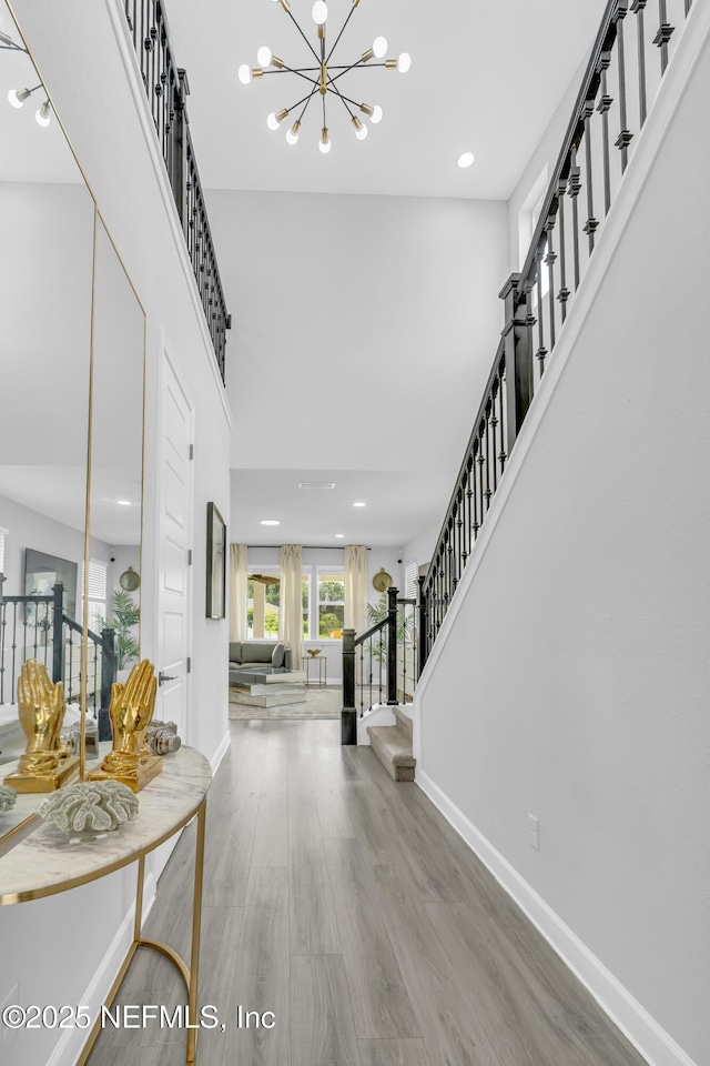 194 Napo Way, Saint Johns, FL 32259 - entrance foyer with a chandelier, stairs, wood finished floors, and recessed lighting