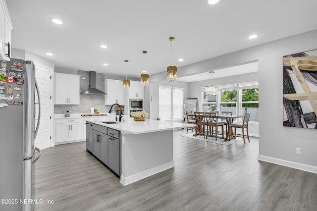 194 Napo Way, Saint Johns, FL 32259 - kitchen with appliances with stainless steel finishes, wall chimney range hood, recessed lighting, light countertops, and white cabinetry